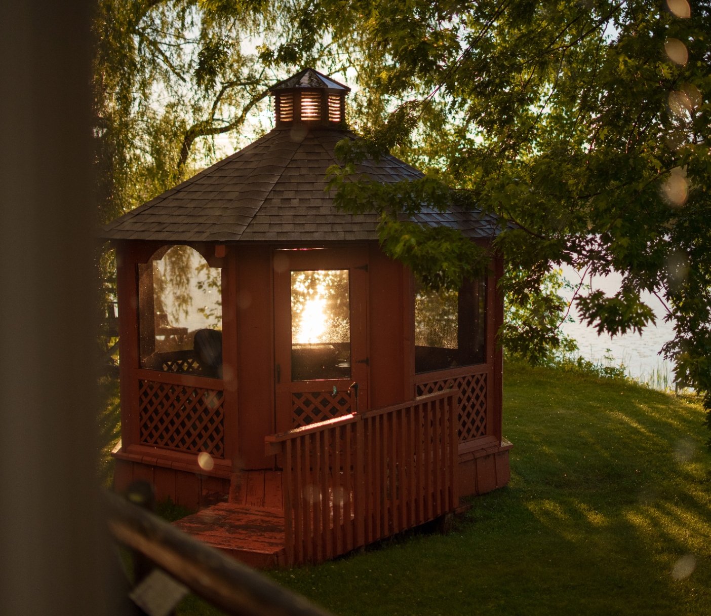 Lakeside gazebo at sunset
